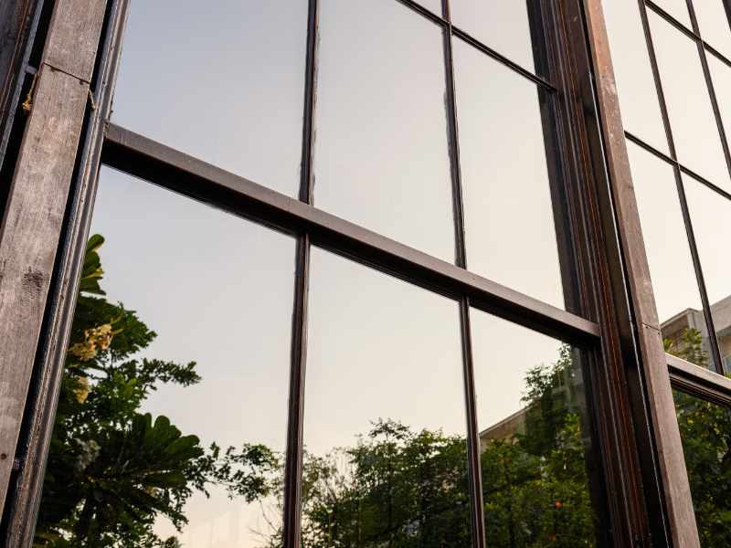 Technician using pure water-fed pole system